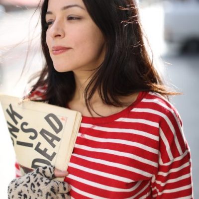 eva Prinz, red stripped shirt with sign