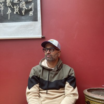 Rajiv mohabir in sweatshirt at Ku Cha Tea House